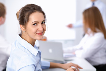 Obraz premium Beautiful business woman at meeting 
