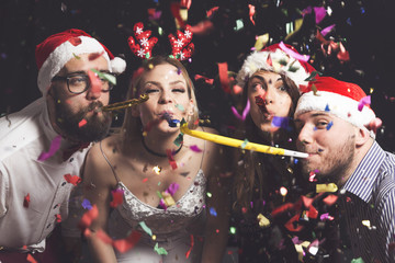 Blowing party whistles