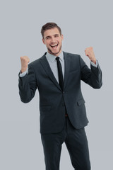 Businessman celebrating  with his fists raised in the air and a 