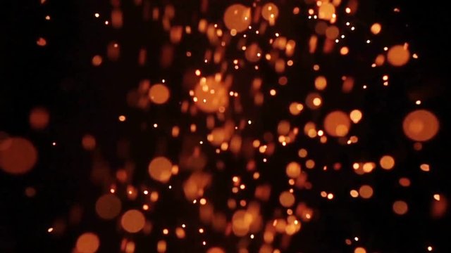 Background of slow motion of firework sparkler burning at night, out of focus