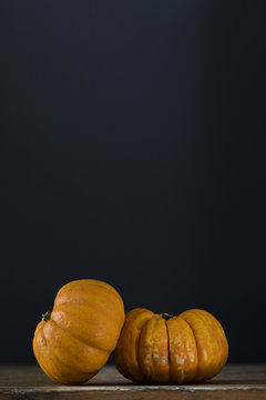 Autumn pumpkins against a dark background