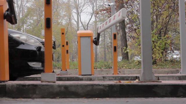 Automatic road barrier gate lifting gate opens and passes car