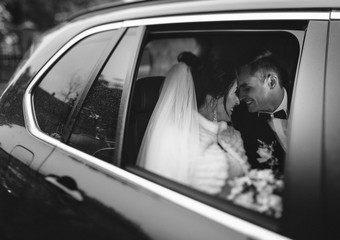 Just married couple sitting in a car