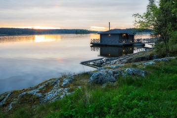 Landscape with a house on the lake in Karelia