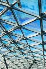 glass roof of building with views of the sky through the glass 