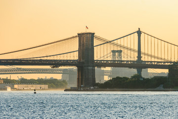 Colors of sunrise over Brooklyn Bridge, New York, USA
