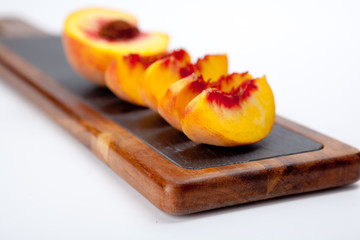 Pieces of peaches on a cutting board
