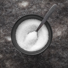 Black  round bowl with sugar