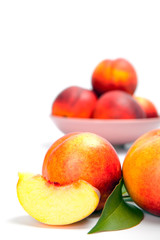 Fototapeta na wymiar Ripe peach (nectarine) isolated on white background