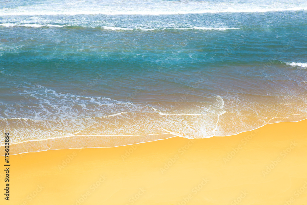 Wall mural wave of the sea on the sand beach