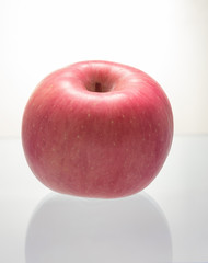 Fresh Fuji apple on white background.