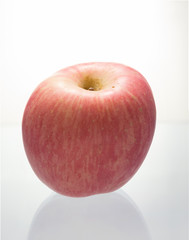 Fresh Fuji apple on white background.