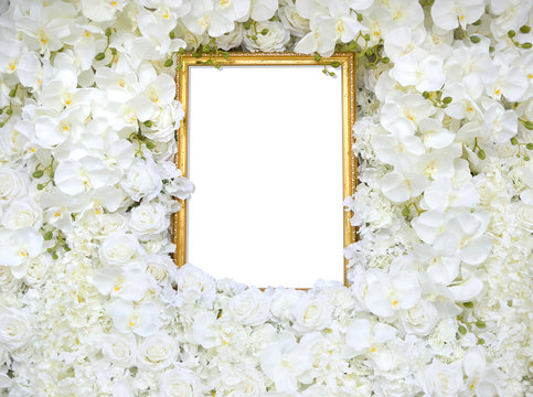 Golden vintage frame with decoration artificial white rose and orchid flower as floral background or copy space with clipping path.Flat lay of old picture frame for valentines day or wedding ceremony.