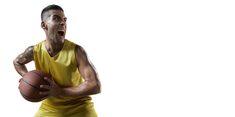 Basketball player hold a basketball ball. Isolated basketball player on a white background. The player is preparing to throw the ball and emotionally shouts. Player wears unbranded clothes.