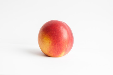 Peach nectarine isolated on a white background