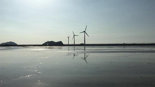 Wind turbines at sunset,Daebudo Island,South Korea.