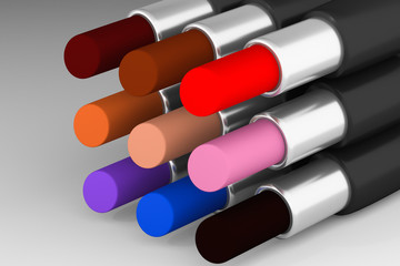 Set of multicolored lipsticks on the light background