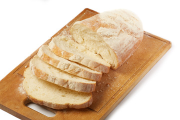 Tasty homemade bread on cutting board. Isolated.