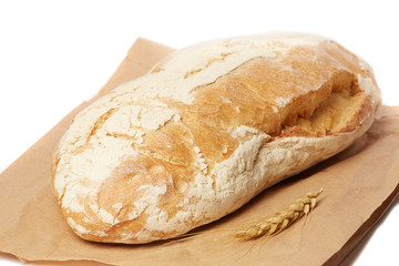Bread on a paper bag isolated on white