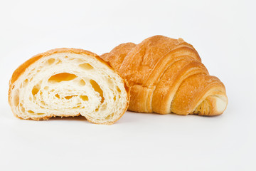 Delicious croissants with cherry jam on a white background