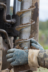 Drilling machine for drilling holes in the ground