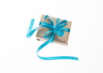 Gift box with ribbon on white