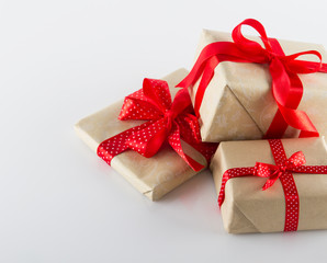Three gifts boxes with ribbons on white
