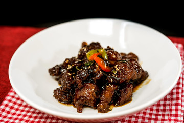 wok fried chicken stir fry with sweet peppers and chinese vegetables