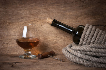 Obraz na płótnie Canvas glass of wine and a bottle
