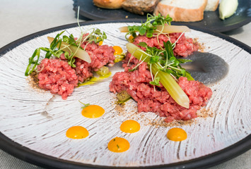 tasty Steak tartare (Raw beef) - classic steak tartare on white plate