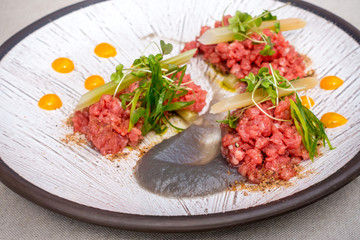 tasty Steak tartare (Raw beef) - classic steak tartare on white plate