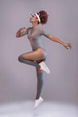 Attractive girl in studio jumping,posing.