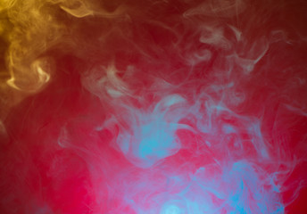 yellow and blue smoke on red background