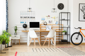 Designed workspace with black clock