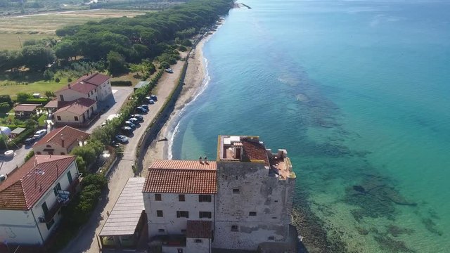 Ancient Tower over a beautiful beach.