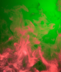 Fototapeta na wymiar red smoke on green background
