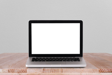 Fototapeta premium Front view of the laptop is on the work table concrete background