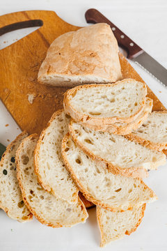 Slices of Cutted Stale Bread on a Chopping Board