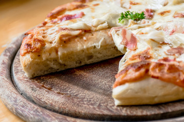 Close up Italian pizza about cheese it stick. Selective focus.Slice of hot pizza large cheese lunch or dinner crust seafood meat topping sauce.Hot Homemade Pepperoni Pizza Ready to Eat