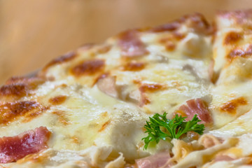 Close up Italian pizza about cheese it stick. Selective focus.Slice of hot pizza large cheese lunch or dinner crust seafood meat topping sauce.Hot Homemade Pepperoni Pizza Ready to Eat
