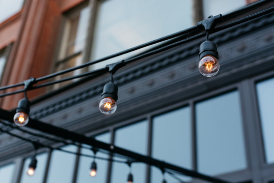 Ornamental light bulbs in front of a building