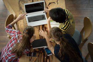 Top view group of students discussing homework with laptop,Education Students People Knowledge...