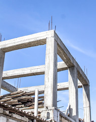 Concrete frame of a building against the sky
