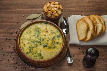 Cheese soup with croutons on the table. Brown color. Copyspace. The view from the top.