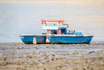 Naklejka premium Old catamaran on the beach