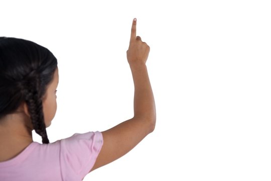 Girl pretending to touch an invisible screen against white