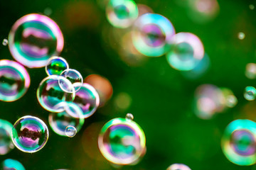 Soap bubbles in nature as a background blur