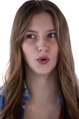 Teenage girl standing against white background