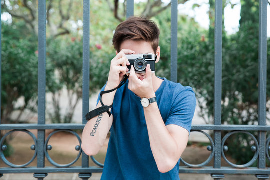 Man taking pictures with a vintage camera