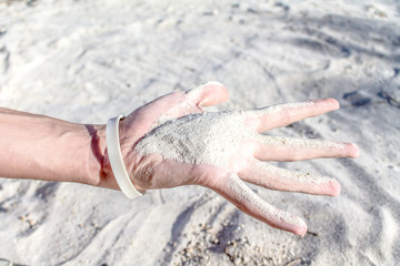 White quartz sand in hand